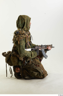 Photos John Hopkins Army Postapocalyptic Suit Poses kneeling whole body…